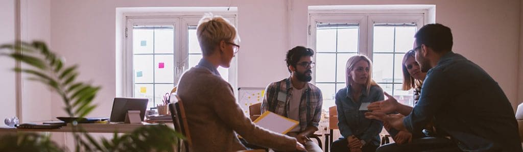 A group of young adults from different cultures in a discussion in richmond va
