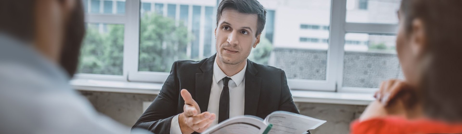 A mediator working with a landlord and tenant to resolve a real estate dispute with mediation A mediator working with a landlord and tenant to resolve a real estate dispute with mediation